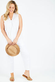 Model Jess wearing size L of the Cotton Crinkle Swing Top in colour White (White), from the front, showing the whole outfit