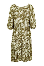 Product shot of the Crinkle Dress in colour Leaves (Green), from the back