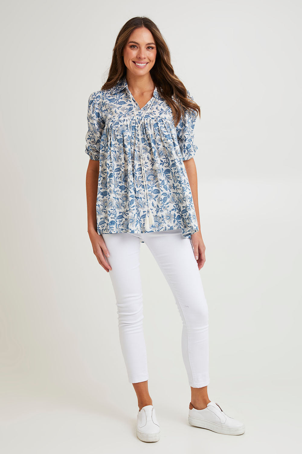 Model Madeline wearing size S of the Cotton Flowy Top in colour Blue (Blue), from the front, showing the whole outfit