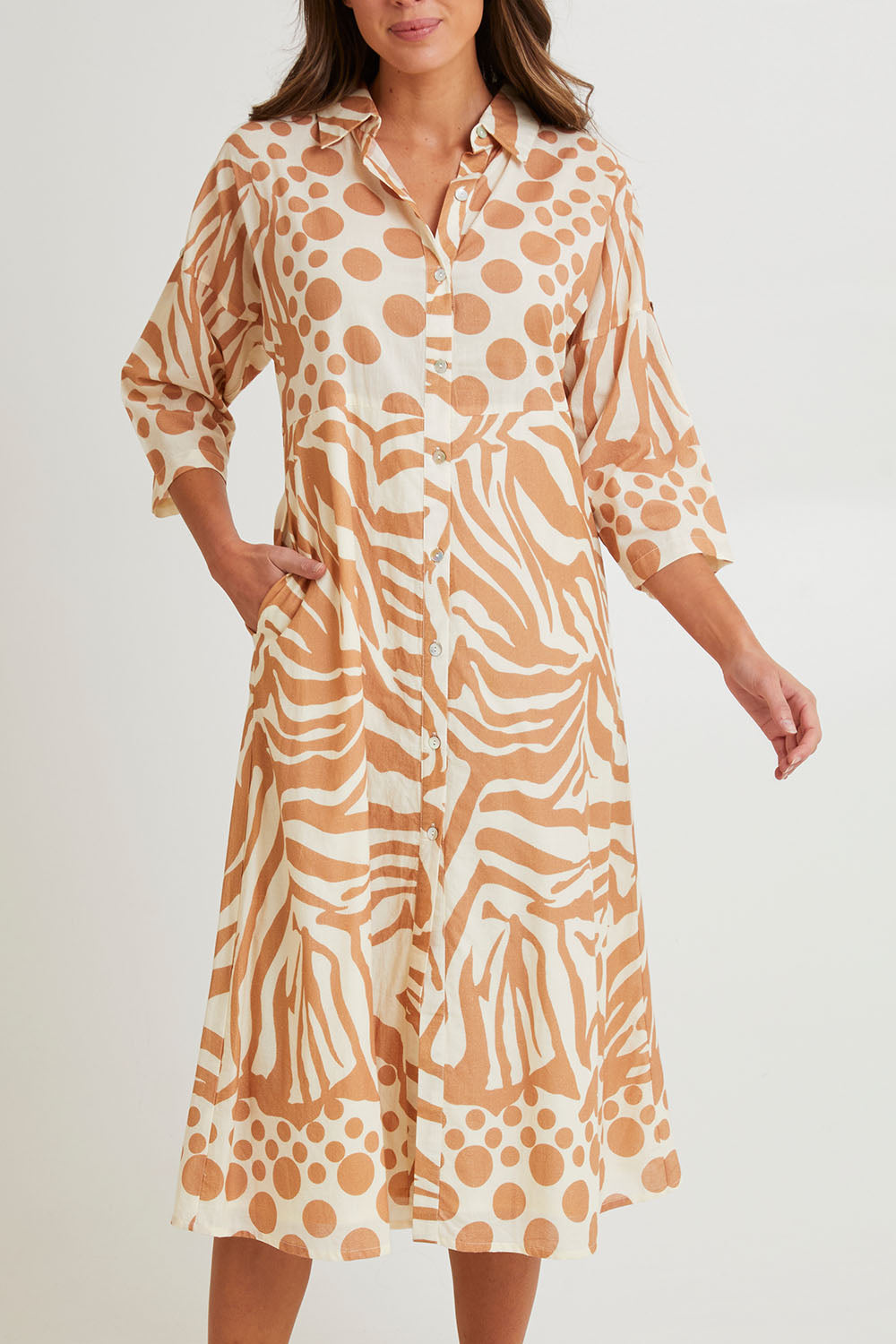 Model Madeline wearing size S of the Cotton Shirt Dress in colour Print, from the front, cropped image