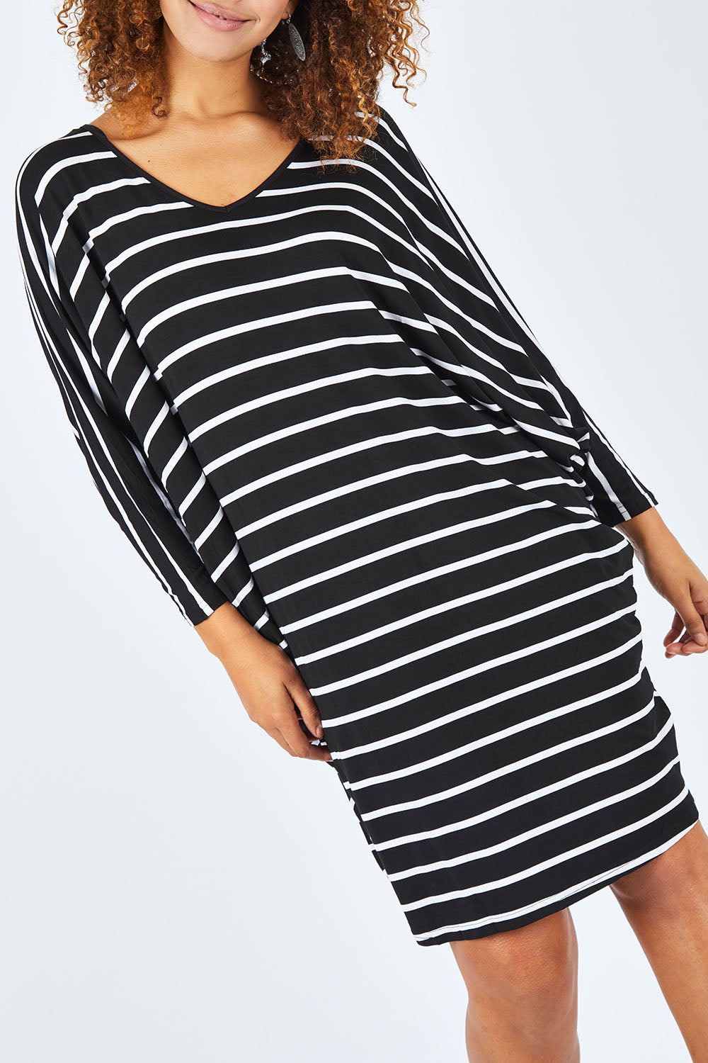 Model Summer wearing size OneSize of the Long Sleeve Stripe Miracle Dress in colour BlackWhite (Black), from the front, cropped image