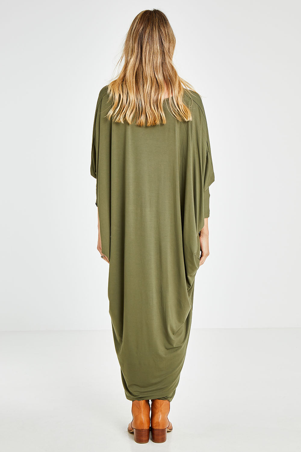Model Kelly wearing size OneSize of the Long Sleeve Maxi Miracle Dress in colour Khaki (Green), from the back