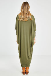 Model Kelly wearing size OneSize of the Long Sleeve Maxi Miracle Dress in colour Khaki (Green), from the back