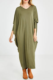 Model Kelly wearing size OneSize of the Long Sleeve Maxi Miracle Dress in colour Khaki (Green), from the front, cropped image