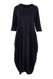 Product shot of the Alviva Lounge Dress in colour Navy (Blue), from the front