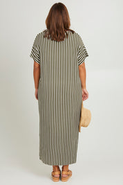 Model Monique wearing the Destiny Dress in colour Green (Green), from the back