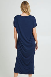 Model Grace wearing the Destiny Round Neck Dress in colour Navy (Blue), from the back