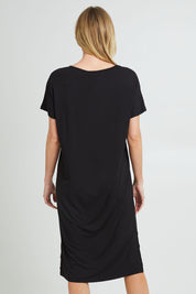 Model Grace wearing the Fate V Neck Dress in colour Black (Black), from the back