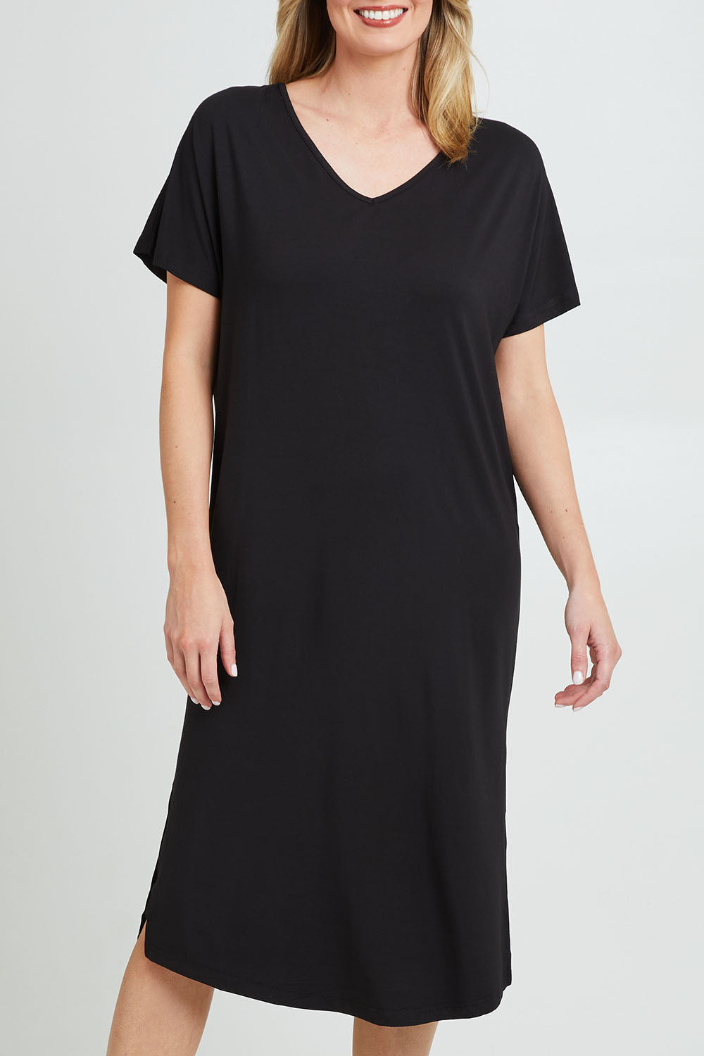 Model Grace wearing the Fate V Neck Dress in colour Black (Black), from the front, cropped image
