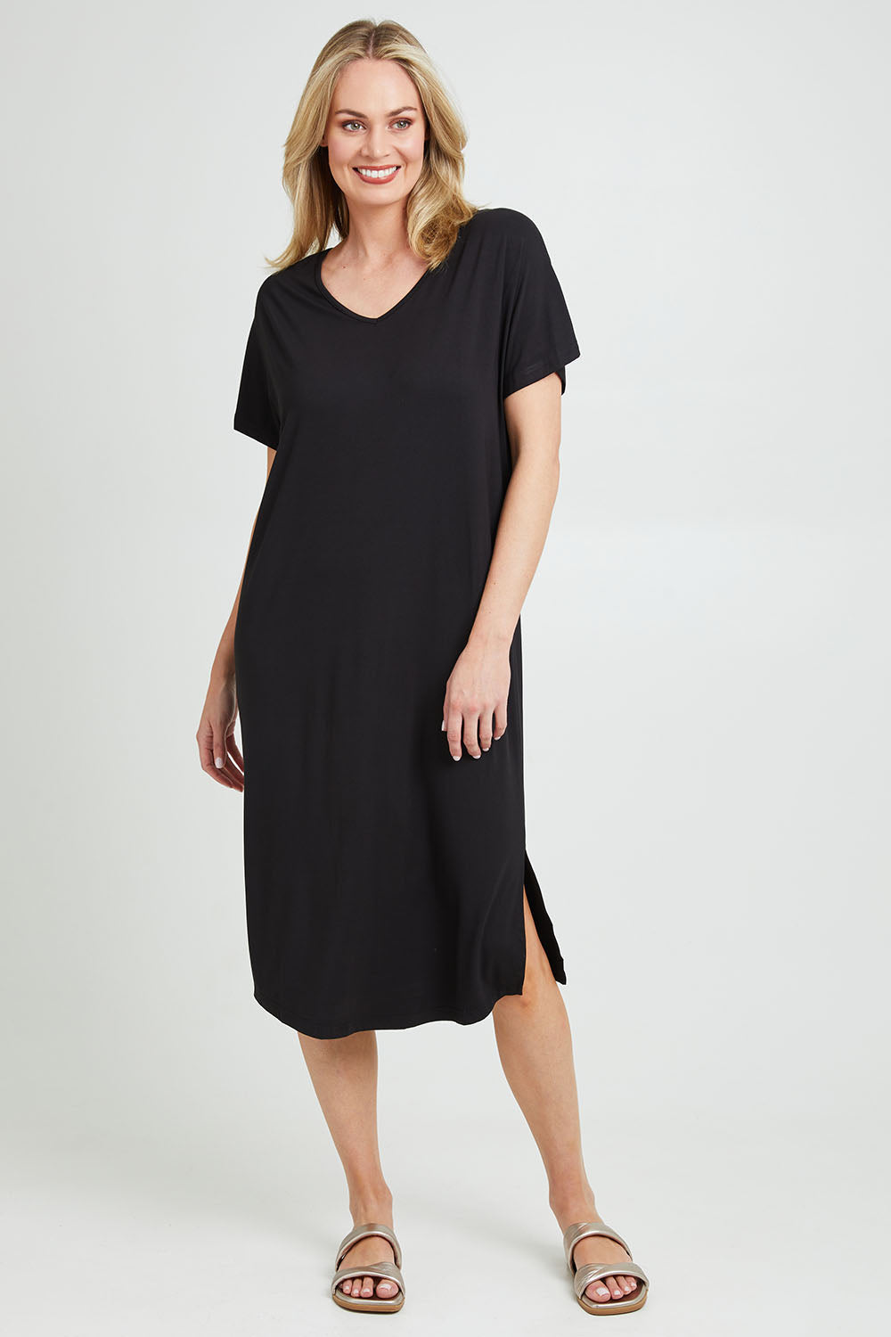 Model Grace wearing the Fate V Neck Dress in colour Black (Black), from the front, showing the whole outfit