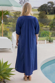 A model wearing the Novella Tencel Blend Dress in colour Pacific (Blue), from the back