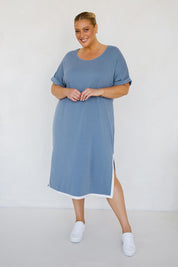 A model wearing the Gigi Lounge Dress in colour Dusk (Blue), from the front, showing the whole outfit