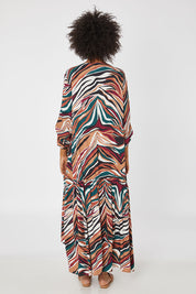 Model Olivia wearing the LS Peak Maxi Dress in colour Hinterland, from the back