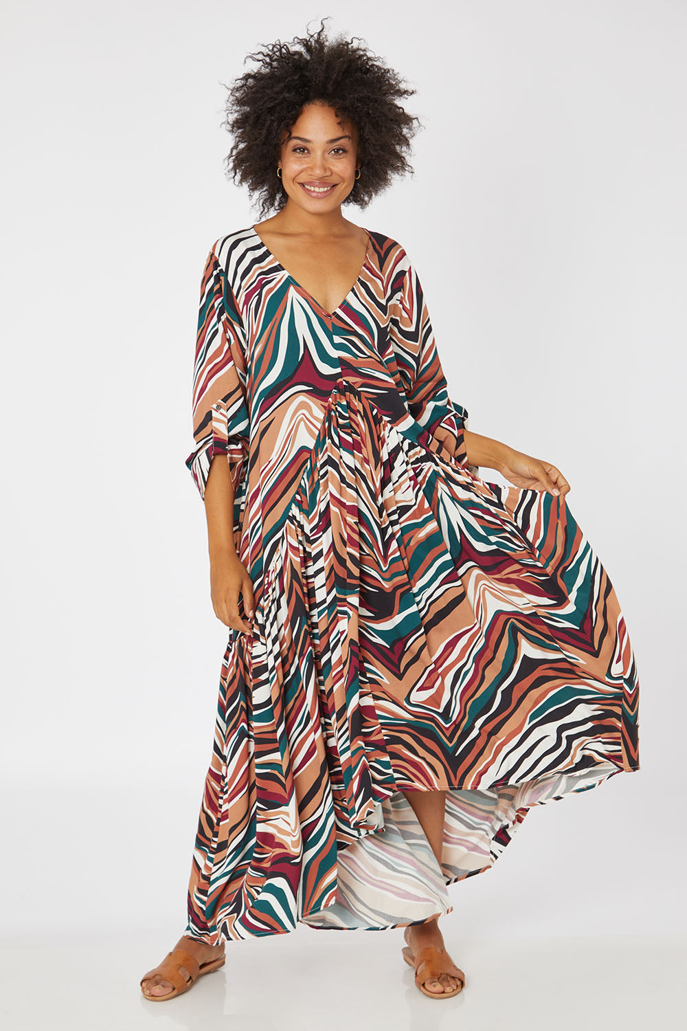 Model Olivia wearing the LS Peak Maxi Dress in colour Hinterland, from the front, showing the whole outfit