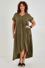 Model Maddy wearing the Short Sleeve Peak Maxi Dress in colour Khaki (Green), from the front, showing the whole outfit
