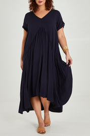 Model Maddy wearing the Short Sleeve Peak Maxi Dress in colour Navy (Blue), from the front, cropped image