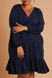 Model Alexis wearing the Long Sleeve Chic Dress in colour Navy (Blue), from the front, cropped image