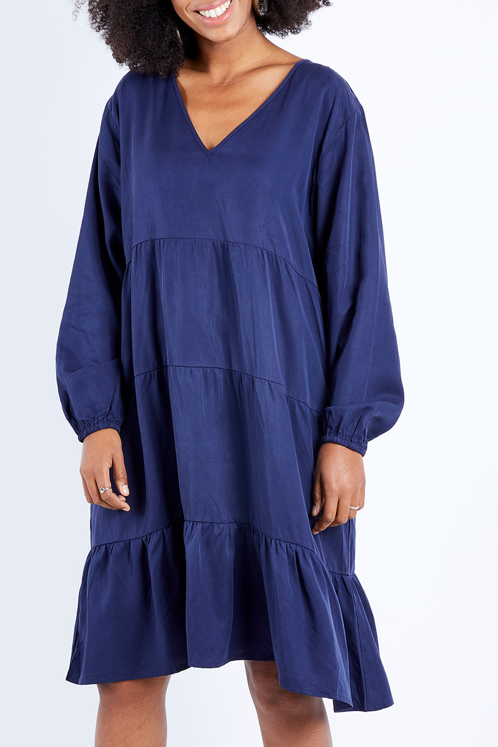 Model Schanez wearing the Long Sleeve Chic Dress in colour Navy (Blue), from the front, cropped image