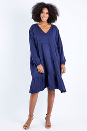 Model Schanez wearing the Long Sleeve Chic Dress in colour Navy (Blue), from the front, showing the whole outfit