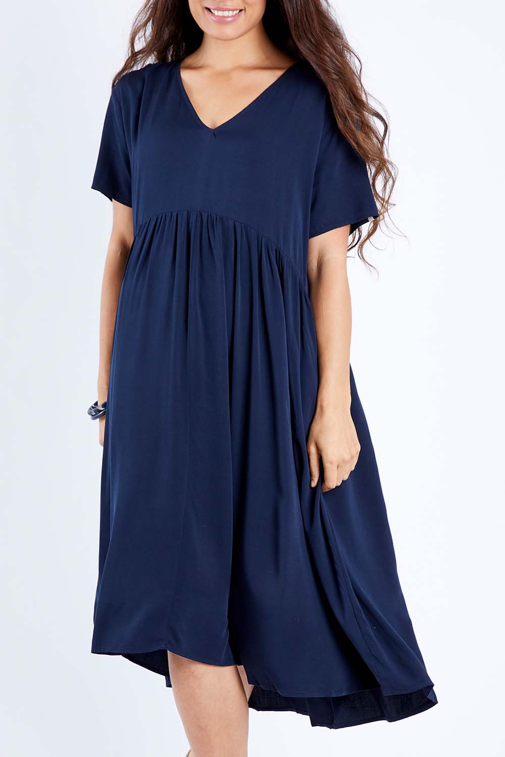 Model Larissa wearing size S of the Wander Dress in colour Navy (Blue), from the front, cropped image