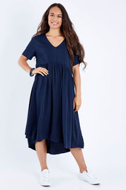 Model Larissa wearing size S of the Wander Dress in colour Navy (Blue), from the front, showing the whole outfit