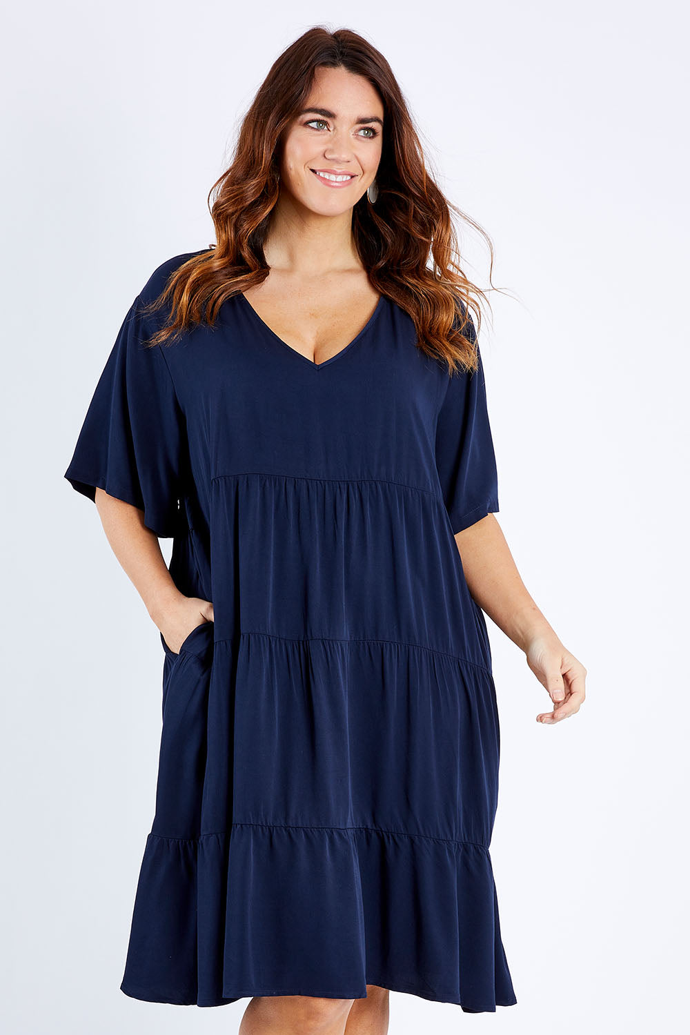 Model Laura wearing the Chic Dress in colour Navy (Blue), from the front, cropped image