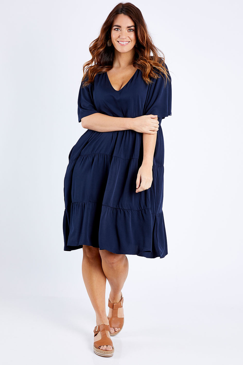 Model Laura wearing the Chic Dress in colour Navy (Blue), from the front, showing the whole outfit