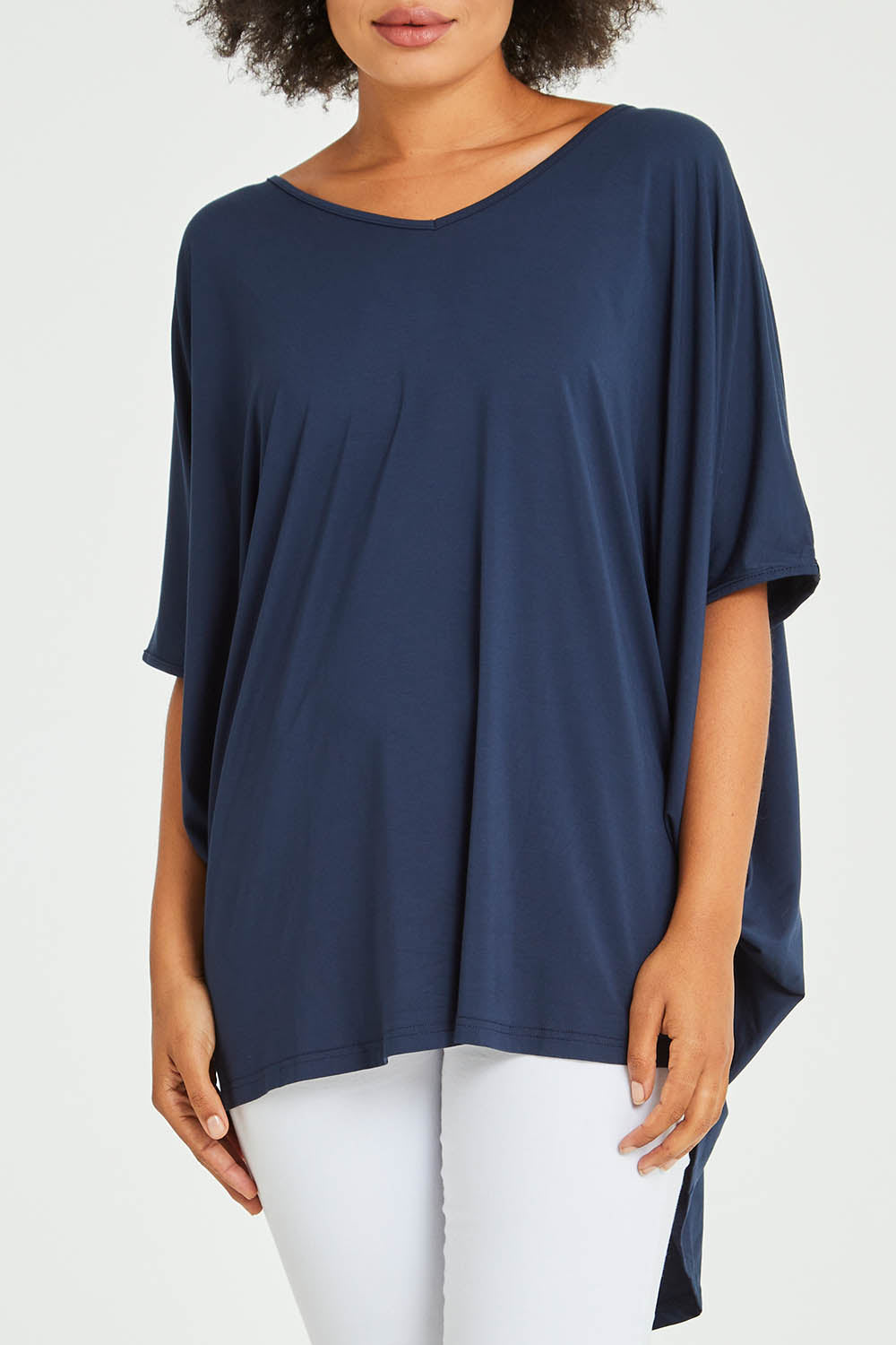 Model Olivia wearing size OneSize of the Hi Low Top in colour Navy (Blue), from the front, cropped image