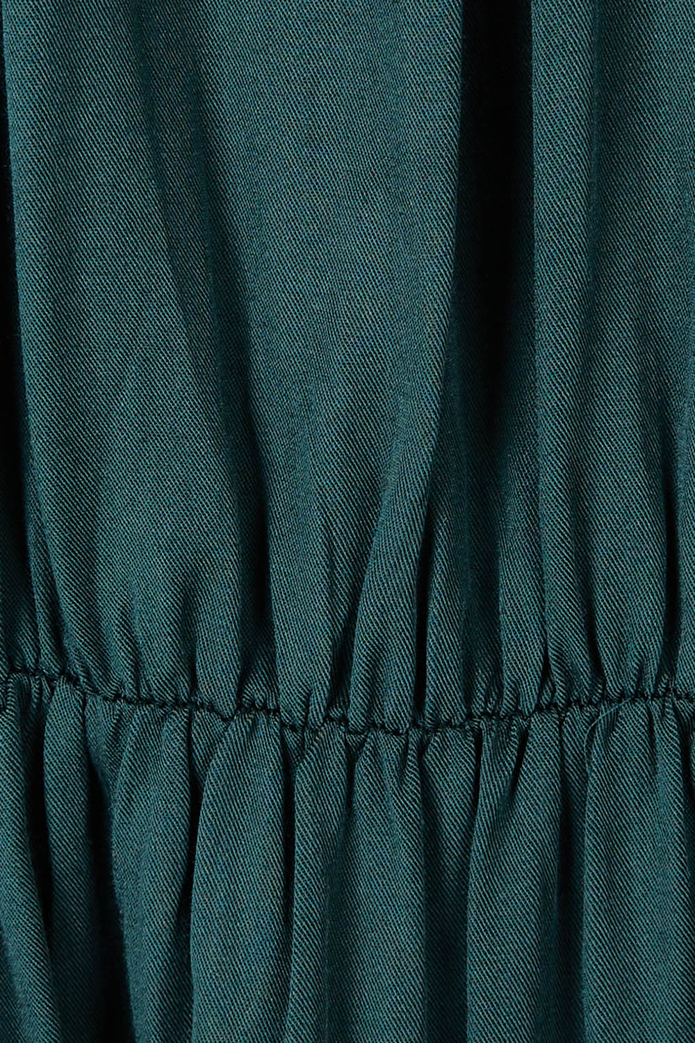 Product shot of the Charlie Top in colour Peacock (Green), detail