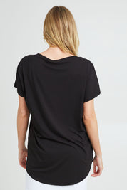 Model Grace wearing the Destiny Top in colour Black (Black), from the back