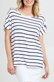 Model Grace wearing the Destiny Top in colour Stripe (White), from the front, cropped image