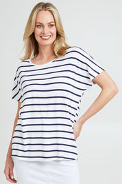 Model Grace wearing the Destiny Top in colour Stripe (White), from the front, cropped image
