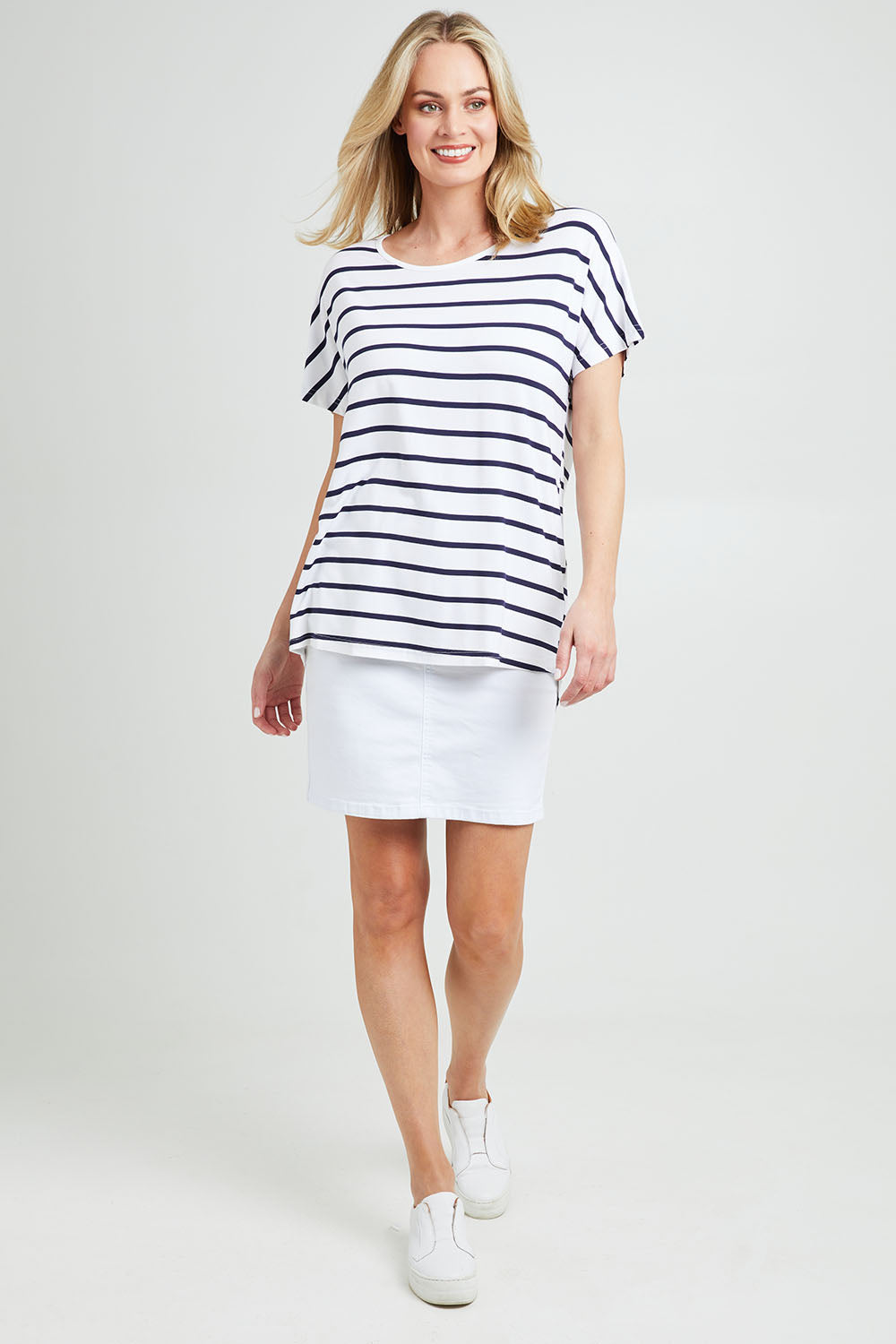 Model Grace wearing the Destiny Top in colour Stripe (White), from the front, showing the whole outfit