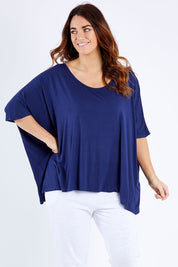 Model Laura wearing size OneSize of the Nice Top in colour Navy (Blue), from the front, cropped image
