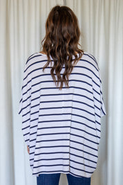 A model wearing the Nice Top in colour Stripe (White), from the back