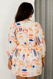 A model wearing the Charlie Top in colour Surfsup, from the back