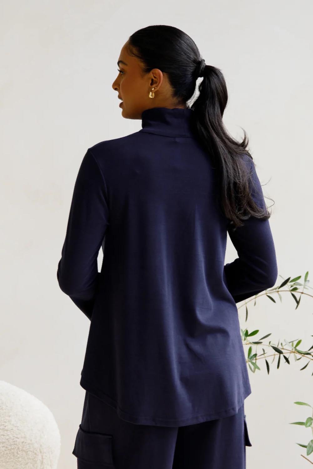 A model wearing the Jazmine Cotton Blend Top in colour Midnight (Blue), from the back