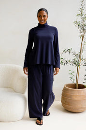 A model wearing the Jazmine Cotton Blend Top in colour Midnight (Blue), from the front, showing the whole outfit
