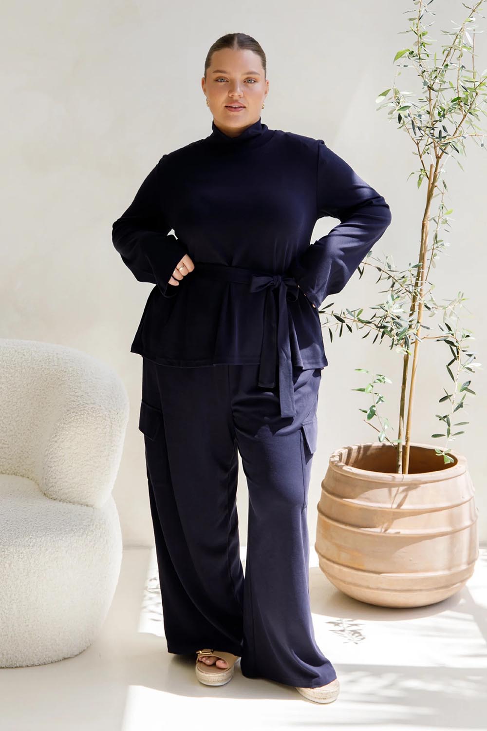 A model wearing the Jazmine Cotton Blend Top in colour Midnight (Blue), from the front, showing the whole outfit