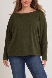 Model Chanel wearing size XL of the Pennie Long Sleeve Top in colour Fern (Green), from the front, cropped image