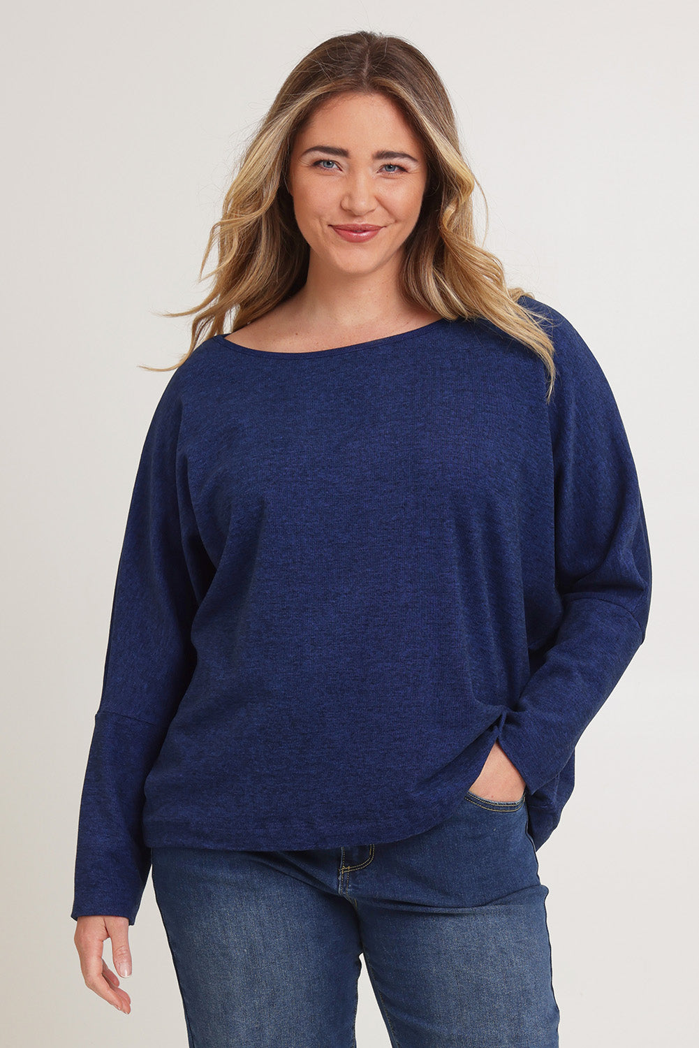 Model Chanel wearing size XL of the Pennie Long Sleeve Top in colour Ocean (Blue), from the front, cropped image