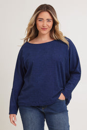 Model Chanel wearing size XL of the Pennie Long Sleeve Top in colour Ocean (Blue), from the front, cropped image