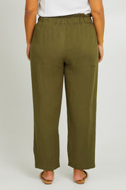 Model Monique wearing size L of the Olivia Pant in colour Greenenvy (Green), from the back