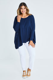 Model Palatina wearing size OneSize of the Long Sleeve Essential Top in colour Navy (Blue), from the front, showing the whole outfit