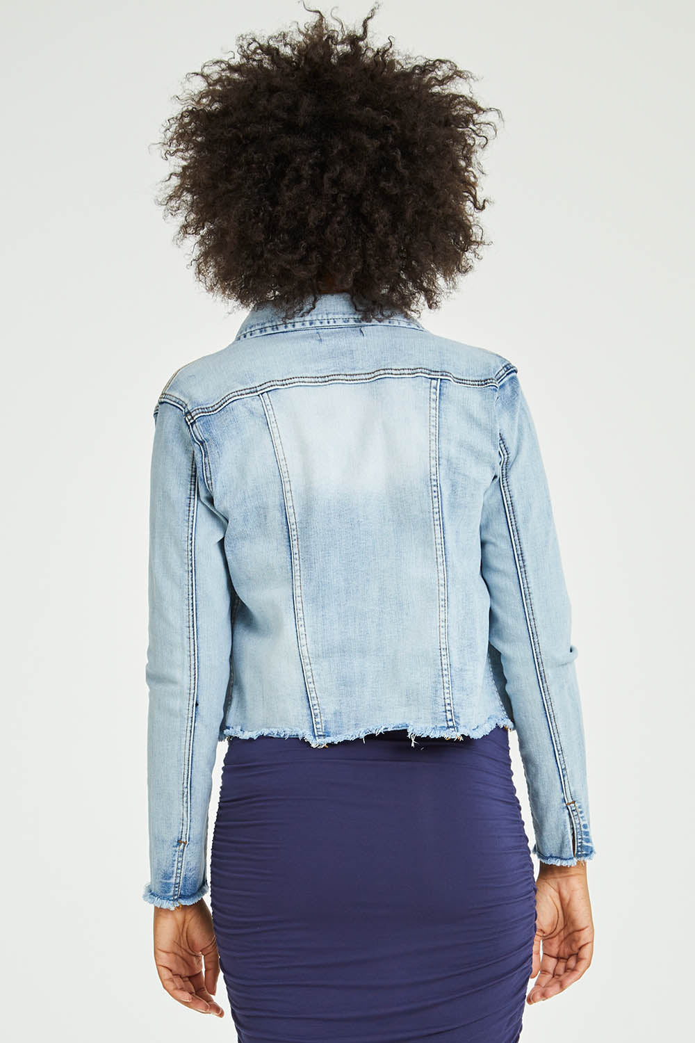 Model Olivia wearing size S of the Denim Jacket in colour LightBlue (Blue), from the back