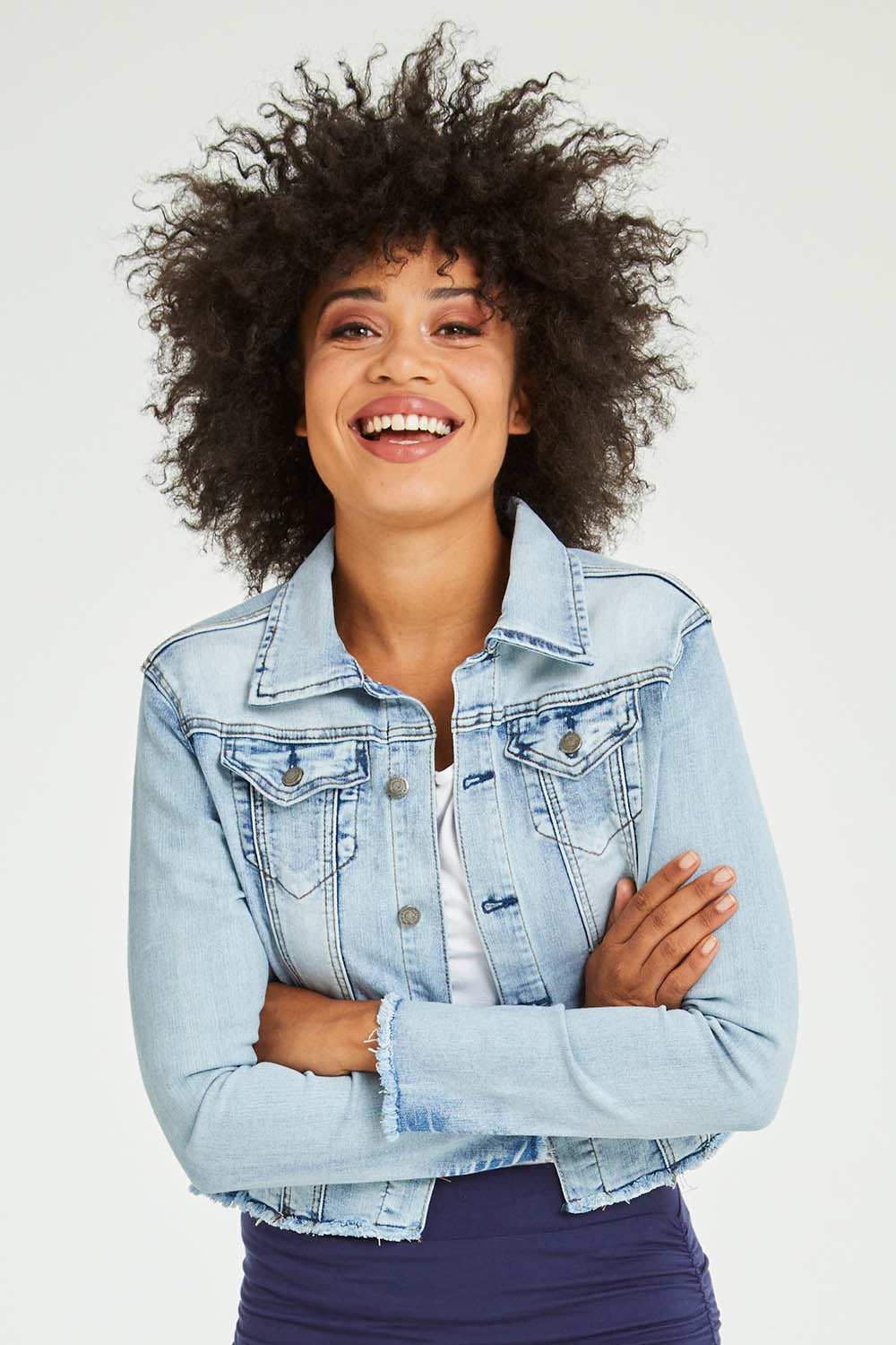 Model Olivia wearing size S of the Denim Jacket in colour LightBlue (Blue), from the front, cropped image