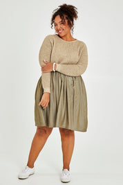 Model Alexis wearing the Lunar Knit Dress in colour Walnut (Green), from the front, showing the whole outfit