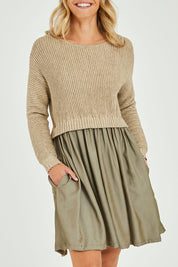 Model Alice wearing the Lunar Knit Dress in colour Walnut (Green), from the front, cropped image