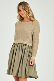 Model Alice wearing the Lunar Knit Dress in colour Walnut (Green), from the front, cropped image