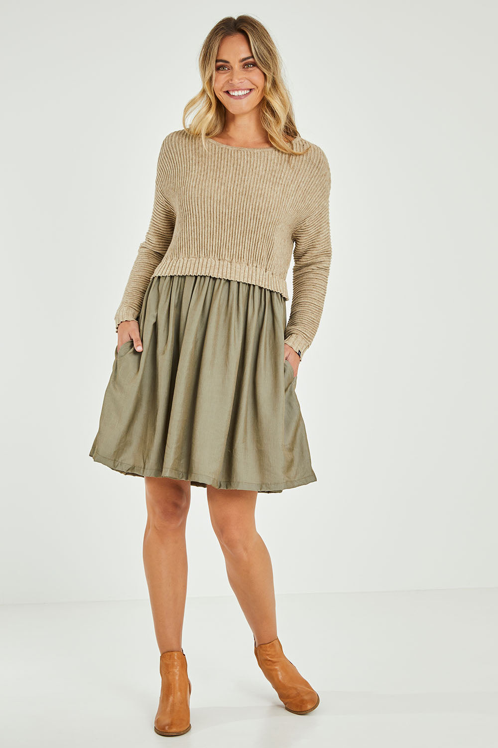 Model Alice wearing the Lunar Knit Dress in colour Walnut (Green), from the front, showing the whole outfit